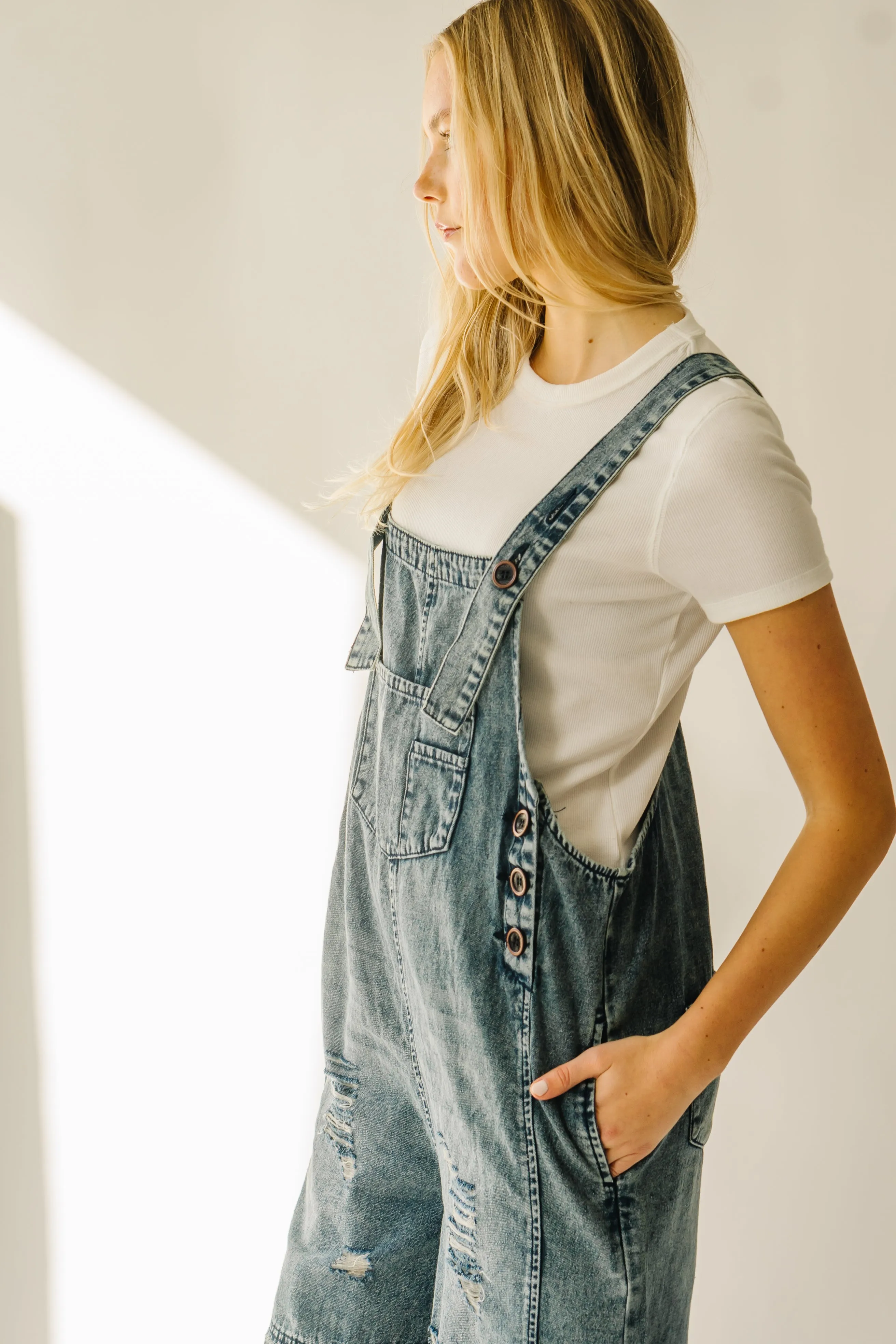 The Dearing Washed Denim Shorts Romper in Vintage Denim